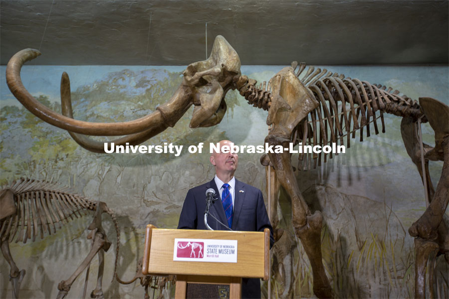 Governor Pete Ricketts talks during the June 14 event at the Nebraska University State Museum. Celebrating the Museum’s 150th anniversary, Governor Pete Ricketts signed a proclamation declaring “State Museum Day” on June 14. The proclamation — signed during a ceremony at the Nebraska University State Museum — honors the state museum system and acknowledges the important cultural contributions made by all museums across Nebraska. It was signed by Ricketts in observance of the anniversary of the day the University’s Board of Regents signed the charter to establish the museum. June 14, 2021. Photo by Troy Fedderson | University Communication.



