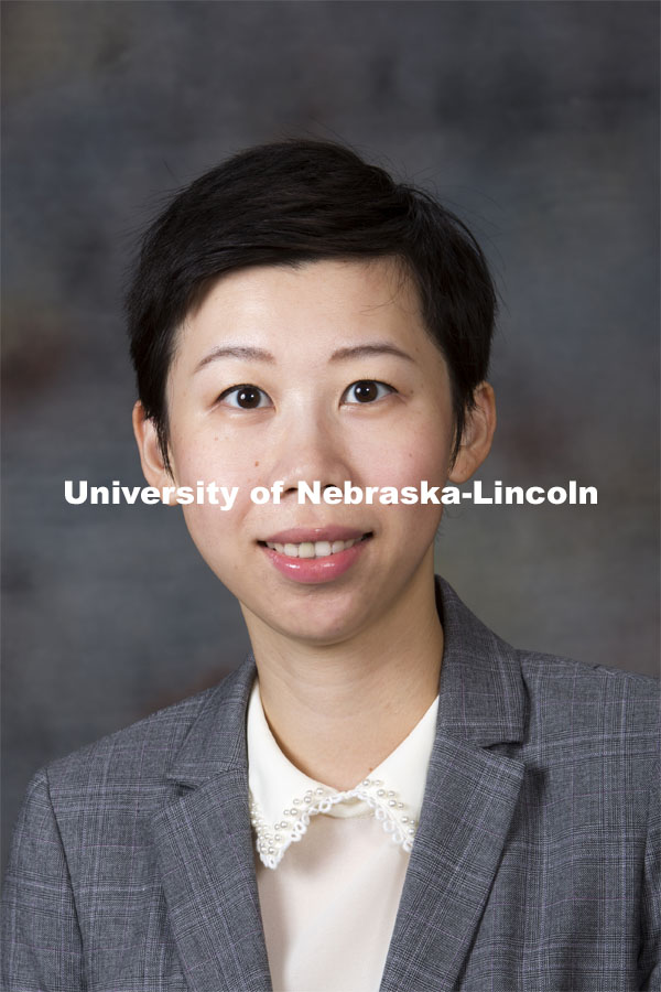 Studio portrait of Jing Wang, Assistant Professor, Finance, August 20, 2014. Photo by Craig Chandler, University Communications.