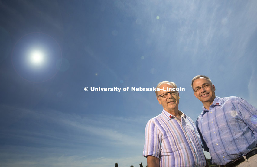 Donald A. Wilhite, Professor Applied Climate Sciences, and Michael J. Hayes, Director and Professor, National Drought Mitigation Center, stand in a field in Lincoln, NE.  Office of Research photo shoot July 7, 2015. Photo by Craig Chandler/University Communications.