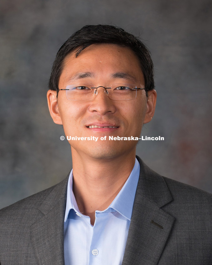 Studio portrait of Changmin Yan, New Faculty Photo Shoot, August 19, 2015. Photo by Greg Nathan, University Communications Photographer.