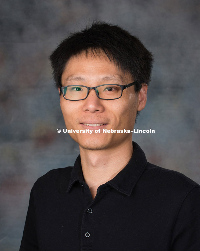 Studio portrait of Zhong Zhang, New Faculty Photo Shoot, August 19, 2015. Photo by Greg Nathan, University Communications Photographer.