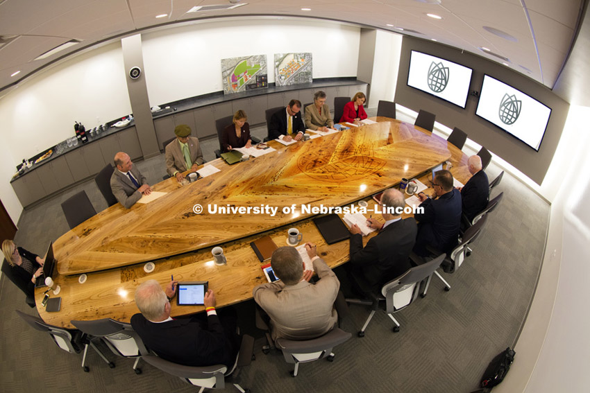Nebraska Innovation Campus board meeting. The board meets around a donated table made from trees cut to make room for the new buildings on NIC. September 10, 2015.   Photo by Craig Chandler / University Communications