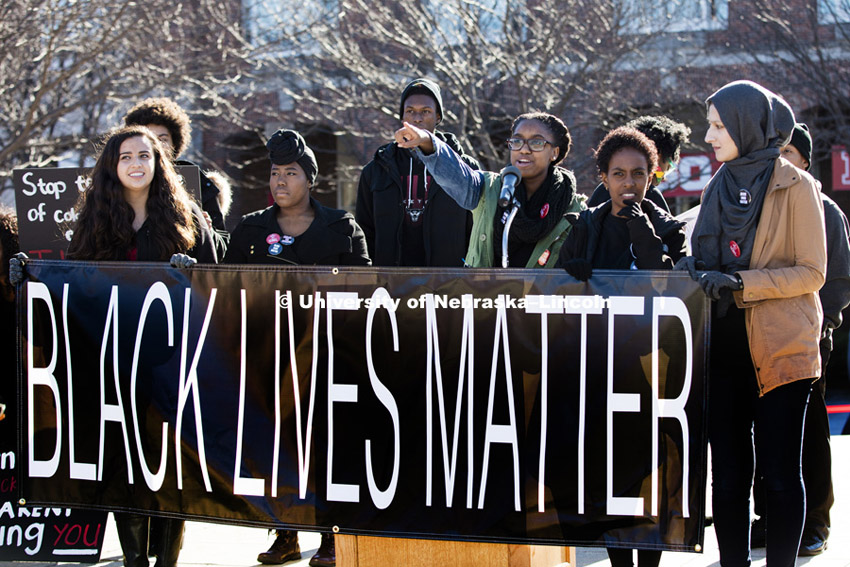 Carnetta Griffin acknowledges the crowd as she leads the rally. Black Lives Matter rally filled the green space north of the Nebraska Union with several thousand students, faculty and staff Thursday. Ten students spoke on their thoughts and experiences. November 19, 2015. Photo by Craig Chandler / University Communications