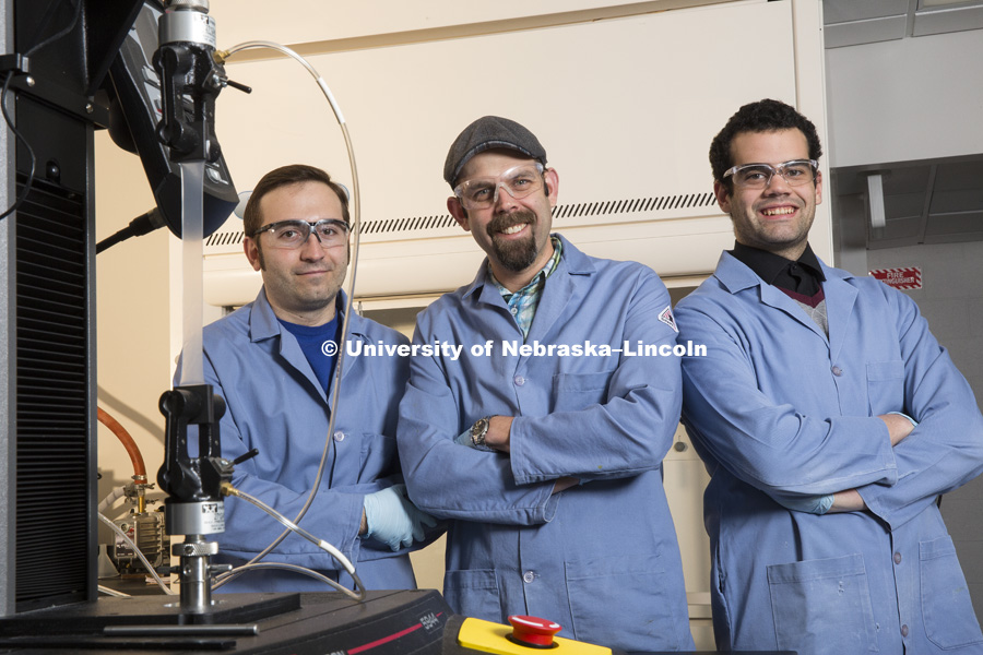 Christos Argyropoulos, left, Stephen Morin and Jay Taylor are a UNL Chemistry team that has developed a method for crafting elastic materials that feature a matte appearance when relaxed but become highly reflective when stretched. This novel capability offers potential applications ranging from passive sensors to soft robotics. January 12, 2016. Photo by Craig Chandler / University Communications