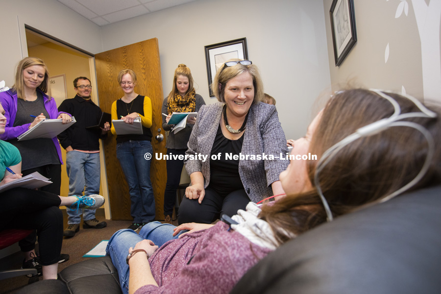 Sherri Jones, Professor and chair of Special Education and Communication Disorders, demonstrates using brain waves to register quality of hearing to audiology students. February 9, 2016. Photo by Craig Chandler / University Communications