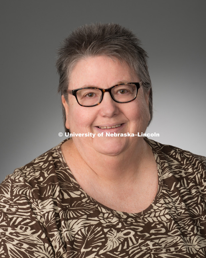 Studio portrait of Adonna Fleming, Library faculty/staff photo for web. May 4, 2016. Photo by Greg Nathan, University Communications Photographer.