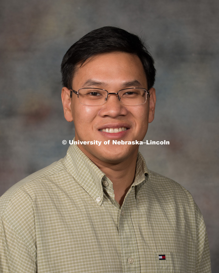 Studio portrait of ThanhVu Nguyen, Assistant Professor, College of Arts and Sciences. New Faculty Orientation. August 29, 2016. Photo by Greg Nathan, University Communication Photography.