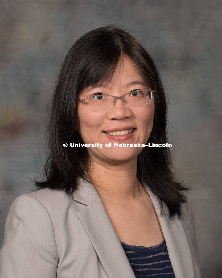 Studio portrait of Huanhuan Shi, Assistant Professor, College of Business. New Faculty Orientation. August 29, 2016. Photo by Greg Nathan, University Communication Photography.