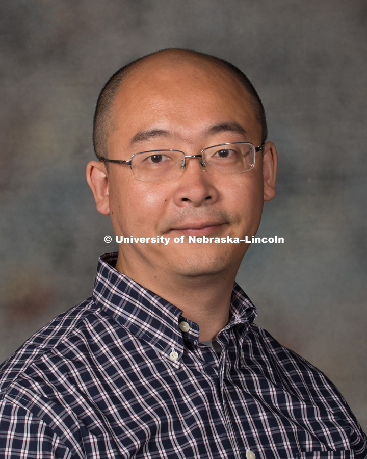 Studio portrait of Zheng Xu, Research Assistant Professor. New Faculty Orientation. August 29, 2016. Photo by Greg Nathan, University Communication Photography.