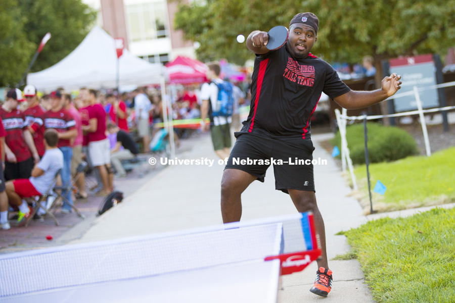 Chris Daniels, a junior from Ohio, makes a defensive backhand as he and other members of the Table Tennis club played to attract members. Big Red Welcome Street Festival. August 22, 2016. Photo by Craig Chandler / University of Nebraska