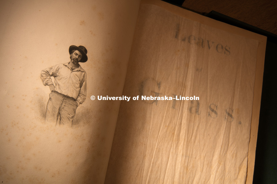 It was discovered that the original 1855 edition of “Leaves of Grass” has variations across copies, due to Walt Whitman’s stop-press revisions, and the fact that it was produced on a hand printing press, which allowed for type to move and fall off. A new grant awarded to the University of Nebraska will allow researchers in the Center for Digital Research in the Humanities (CDRH) to examine about 20 of the original copies to record and research the variations and build an online variorum accessible to scholars and casual readers alike.Ken Price, Hillegass Professor of English and co-director of the CDRH shows students some of the items in the Whitman Collection of Love Library. Price will oversee the research on the grant. August 23, 2016. Photo by Craig Chandler / University of Nebraska.