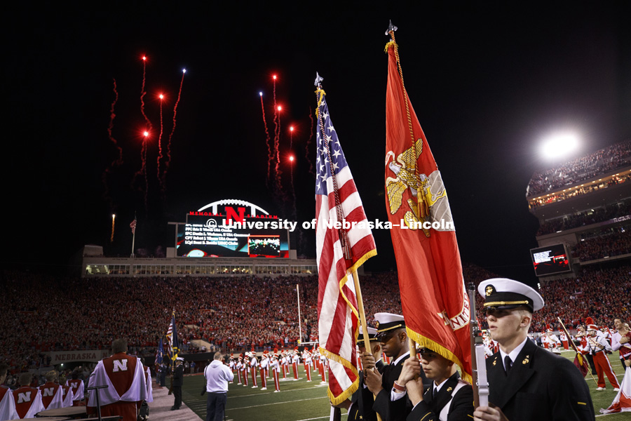 Fireworks explode over the scoreboard during the pre-game performance by the Cornhusker Marching Band. The pregame featuring the military songs of each branch before the National Anthem with a color guard from each branch before the National Anthem. Nebraska vs. Minnesota football. Veteran and Military Appreciation Game. November 12, 2016. Photo by Craig Chandler / University Communication Photography.