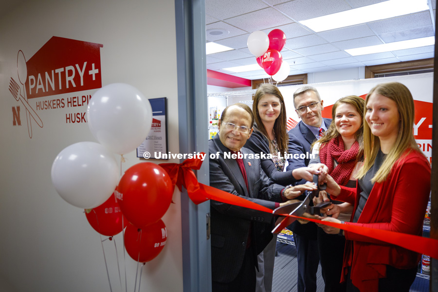 Vice Chancellor Juan Franco and Chancellor Ronnie Green  help cut the ribbon. Huskers Helping Huskers on campus food pantry was opened on January 9, 2017. Photo by Craig Chandler / University Communication.
