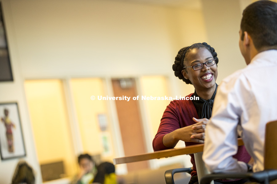 Susie Brown, NCPA Program Associate with the Office of Admissions talks with a co-worker in the Jackie Gaughan Multicultural Center. January 10, 2017. Photo by Craig Chandler / University Communication.