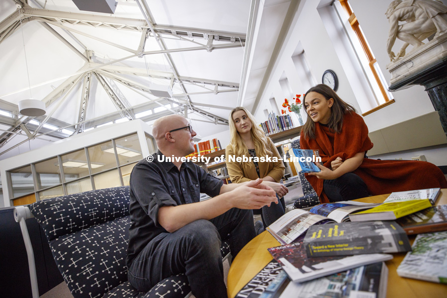 Photo shoot for Master of Science in Architecture with a Specialization in Interior Design. Students Bryan Perez, Sierra Penas and Morgan Ronspies gather together in the Architecture Library. January 25, 2017  Photo by Craig Chandler/University
