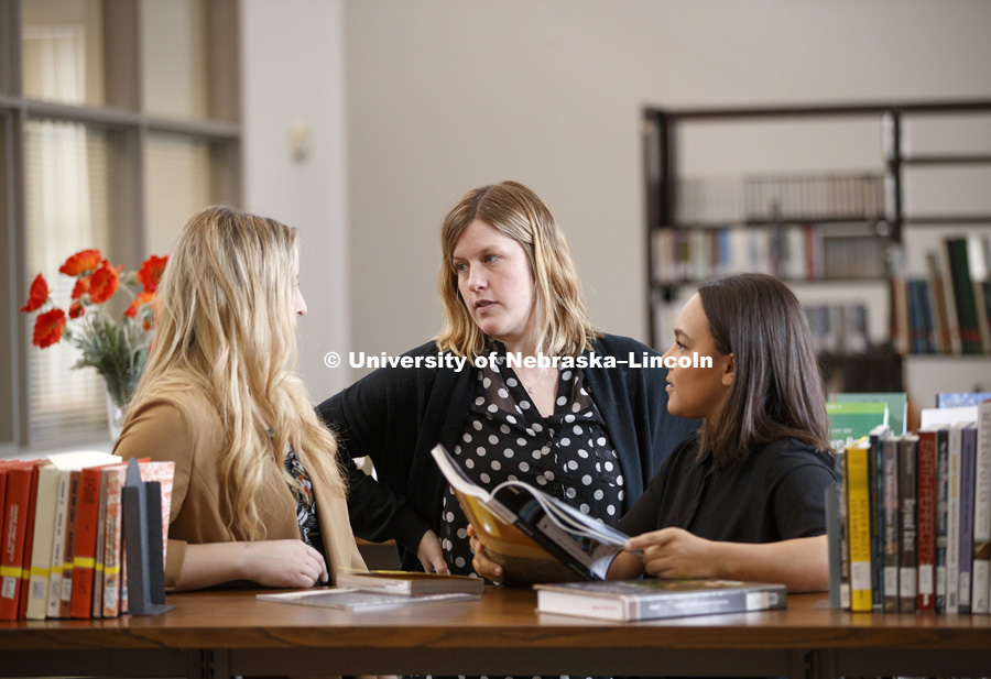 Photo shoot for Master of Science in Architecture with a Specialization in Interior Design. Faculty Lindsey Ellsworth-Bahe talks to Sierra Penas and Morgan Ronspies, Interior Design students. January 25, 2017. Photo by Craig Chandler/University