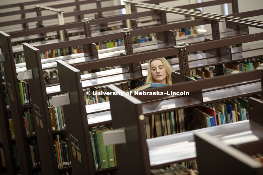 Photo shoot for Master of Science in Architecture with a Specialization in Interior Design. Student, Morgan Ronspies studies in the Architecture Library. January 25, 2017. Photo by Craig Chandler/University Communication.