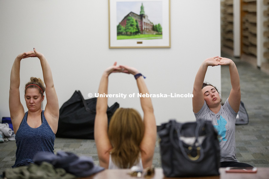 Yoga in the Law Library. College of Law photo shoot. March 9, 2017. Photo by Craig Chandler / University Communication.