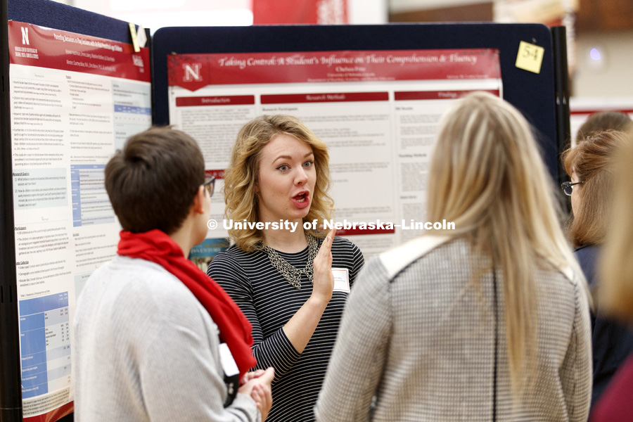 Emma Loberg discusses her research in parenting behaviors in play sessions with at-risk preschool children. The first day of the Spring Research Fair features undergraduate student research. April 4, 2017. Photo by Craig Chandler / University