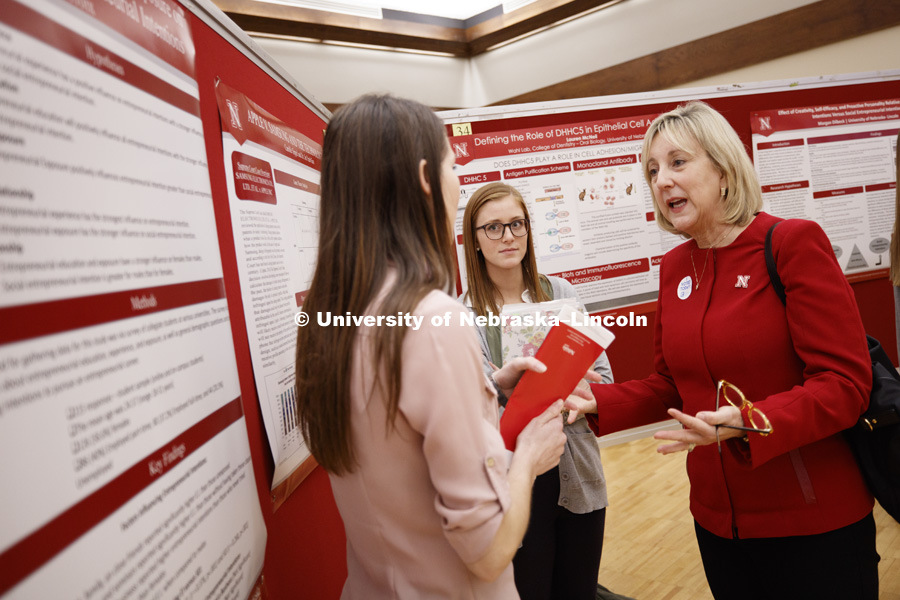 Donde Plowman, Executive Vice Chancellor and Chief Academic Officer, talks with students at the Research Fair on Tuesday afternoon. The first day of the Spring Research Fair features undergraduate student research. April 4, 2017. Photo by Craig Chandler /