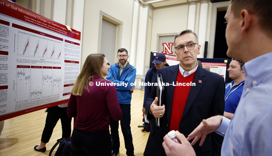 Chancellor Ronnie Green listens to a student's research at the Research Fair on Tuesday afternoon. The first day of the Spring Research Fair features undergraduate student research. April 4, 2017. Photo by Craig Chandler / University Communication.