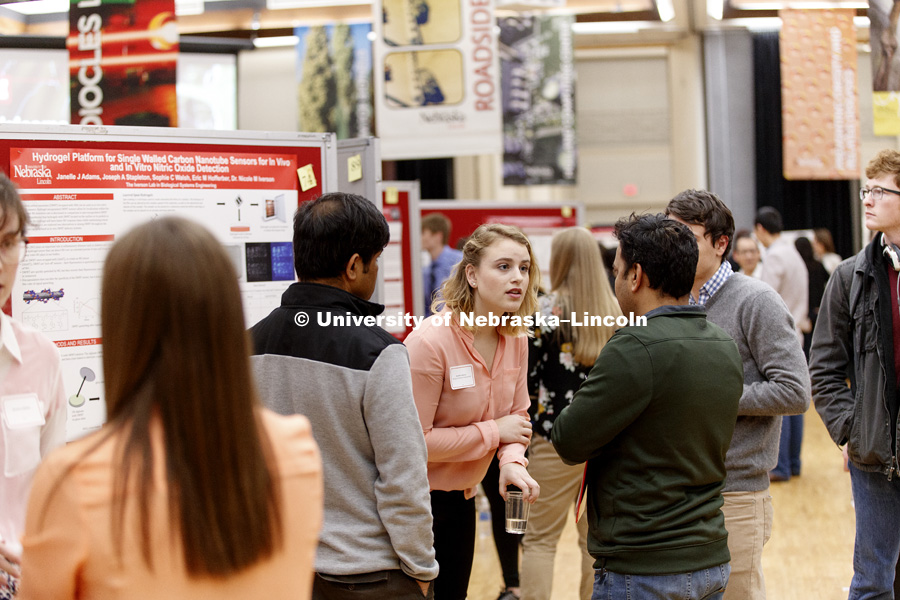 Janelle Adams listens to a question while discussing her research. The first day of the Spring Research Fair features undergraduate student research. April 4, 2017. Photo by Craig Chandler / University Communication.
