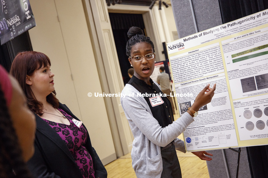 Harriet Appeah talks about the pathogenicity of magnaporthe oryzae during the research fair. The first day of the Spring Research Fair features undergraduate student research. April 4, 2017. Photo by Craig Chandler / University Communication.