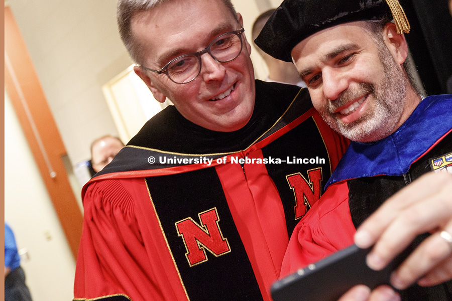 Chancellor Ronnie Green stops for a selfie with Professor Ken Bloom before the ceremony. Installation Ceremony for Chancellor Ronnie Green. April 6, 2017. Photo by Craig Chandler / University Communication.