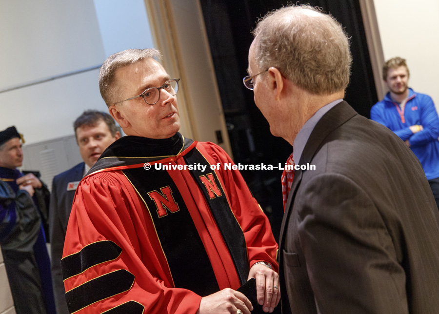 Chancellor Ronnie Green talks for a moment with former Chancellor Harvey Perlman before the ceremony. Installation Ceremony for Chancellor Ronnie Green. April 6, 2017. Photo by Craig Chandler / University Communication.