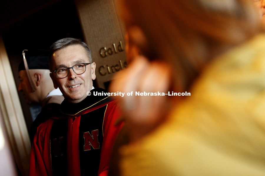 Chancellor Ronnie Green greets people while waiting for the processional. Installation Ceremony for Chancellor Ronnie Green. April 6, 2017. Photo by Craig Chandler / University Communication.