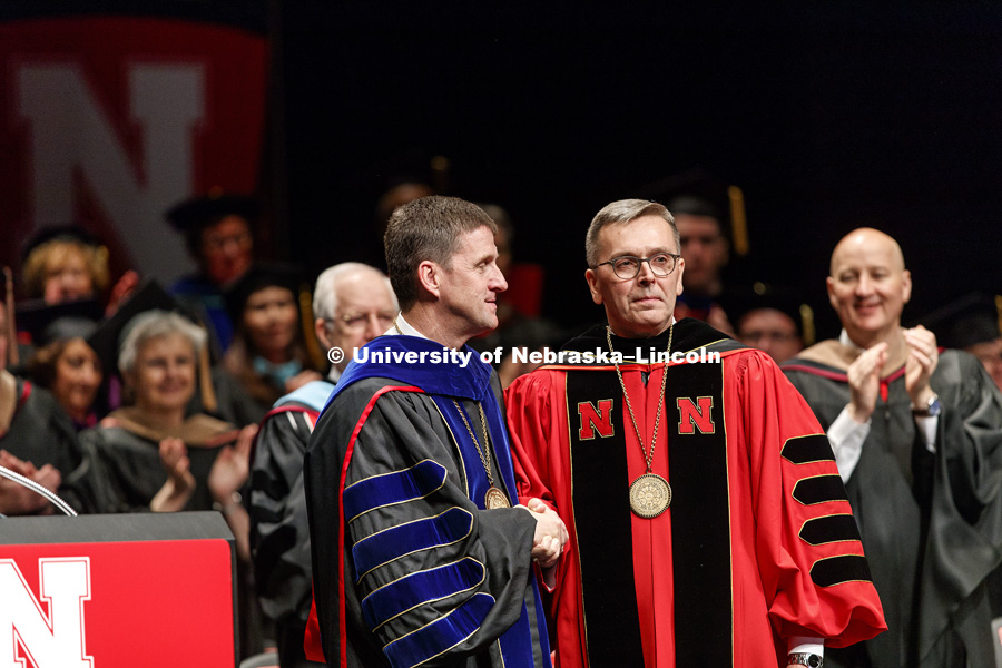 Chancellor Ronnie Green is congratulated by University of Nebraska President Hank Bounds after being formally installed as chancellor.  Installation Ceremony for Chancellor Ronnie Green. April 6, 2017. Photo by Craig Chandler / University Communication.