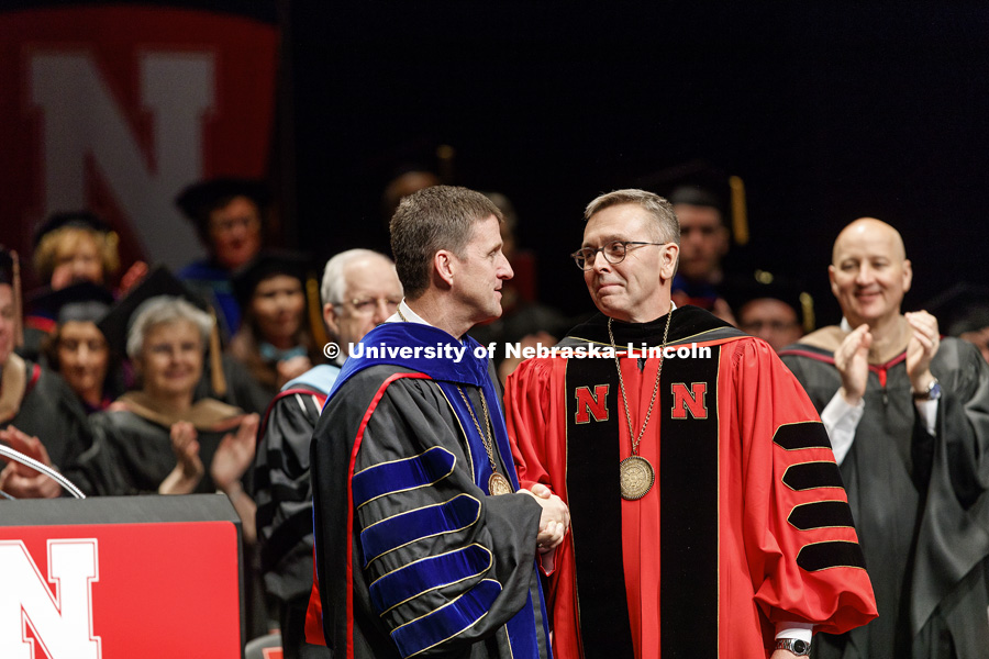 Chancellor Ronnie Green is congratulated by University of Nebraska President Hank Bounds after being formally installed as chancellor.  Installation Ceremony for Chancellor Ronnie Green. April 6, 2017. Photo by Craig Chandler / University Communication.