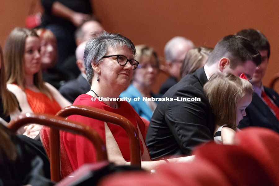 Jane Green, wife of Chancellor Ronnie Green, listens as her husband gives his response speech. Installation Ceremony for Chancellor Ronnie Green. April 6, 2017. Photo by Craig Chandler / University Communication.