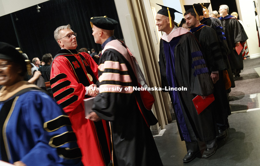 Chancellor Ronnie Green shakes hands of the platform party backstage of the Lied following the ceremony. Installation Ceremony for Chancellor Ronnie Green. April 6, 2017. Photo by Craig Chandler / University Communication.