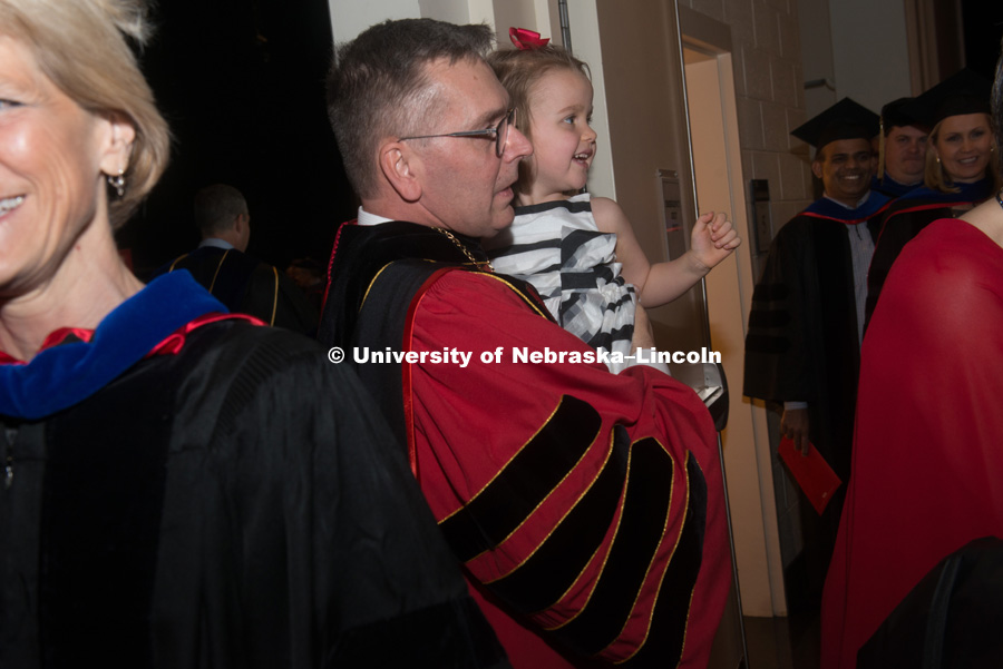 Chancellor Ronnie Green is greeted by his granddaughter, Charlotte, and his wife, Jane, backstage of the Lied following the ceremony. Installation Ceremony for Chancellor Ronnie Green. April 6, 2017. Photo by Greg Nathan University Communication