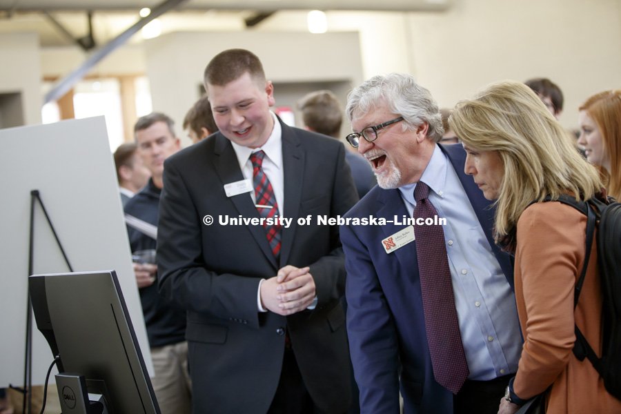 Jeffrey S. Raikes and his wife, Tricia, listen to student presentations during the Raikes School Design Studio. April 21, 2017. Photo by Craig Chandler / University Communication.