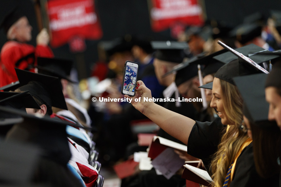 Alexandria Leavenworth takes a selfie of her and Amy Lester while seated in the arena. Students earning graduate and professional degrees received their diplomas Friday afternoon in Lincoln's Pinnacle Bank Arena. Undergraduate commencement is Saturday