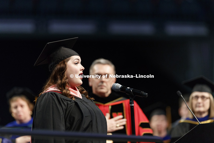 Emily Triebold sings the National Anthem. Triebold also received her masters of music degree during the ceremony. Students earning graduate and professional degrees received their diplomas Friday afternoon in Lincoln's Pinnacle Bank Arena. Undergraduate