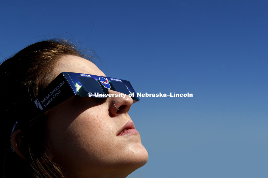 Hannah Paxton, senior in advertising and marketing, and Teaching Assistant for Professor Michael Sibbernsen, eyes the sun using NASA-provided safety glasses. Michael Sibbernsen, Lecturer of Astronomy- University of Nebraska-Lincoln, Special Projects