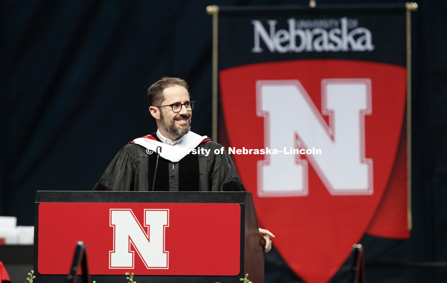 Evan Williams, Nebraska native and founder of Twitter, smiles at his family in the arena while delivering the commencement address. Williams received an honorary degree before he delivered the Commencement Address "Farm Kid Swipes Fire". Students received