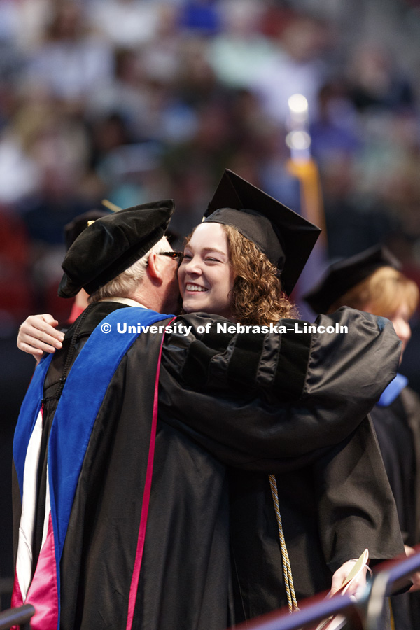 Amanda Clyner hugs Dean Steven Waller after she received her College of Agricultural Sciences and Natural Resources degree. Clyner worked as a student worker in the dean's office for 3 1/2 years. Students received their undergraduate diplomas Saturday
