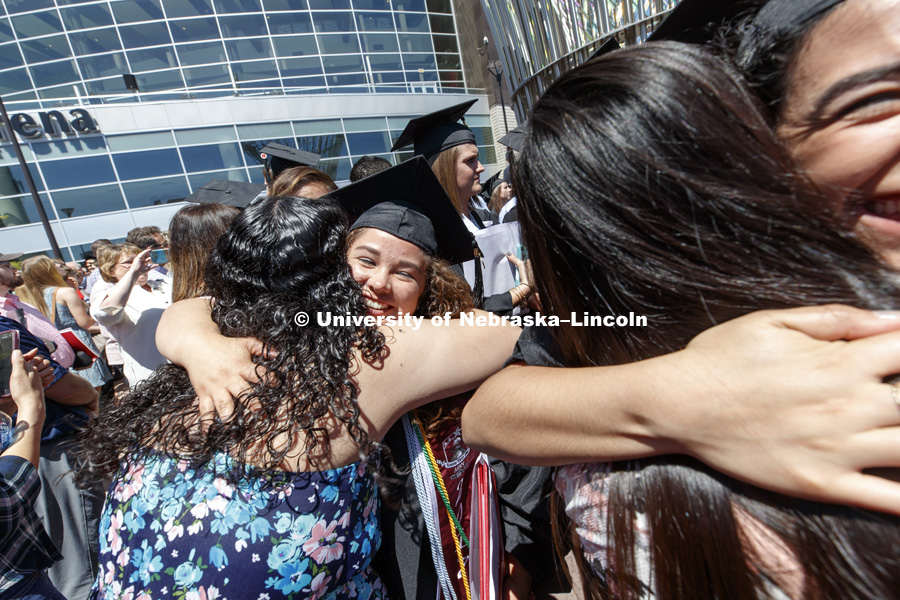 Kimberly Ruiz receives a hug as the graduates flow out of the arena following commencement. Students received their undergraduate diplomas Saturday morning in Lincoln's Pinnacle Bank Arena. 2452 degrees were awarded Saturday morning. May 6, 2017. Photo by