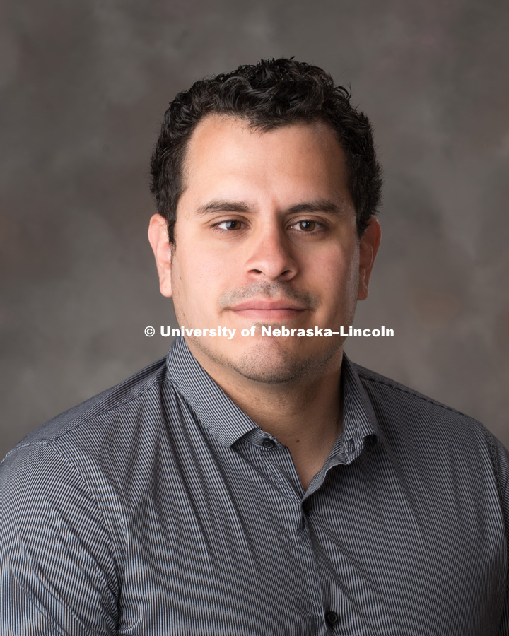 Studio portrait of Gerardo Saldana, Financial Aid Advisor, Emerging Leaders and Short Term Loans, Office of Scholarships and Financial Aid. May 18, 2017. Photo by Greg Nathan, University Communication Photography.