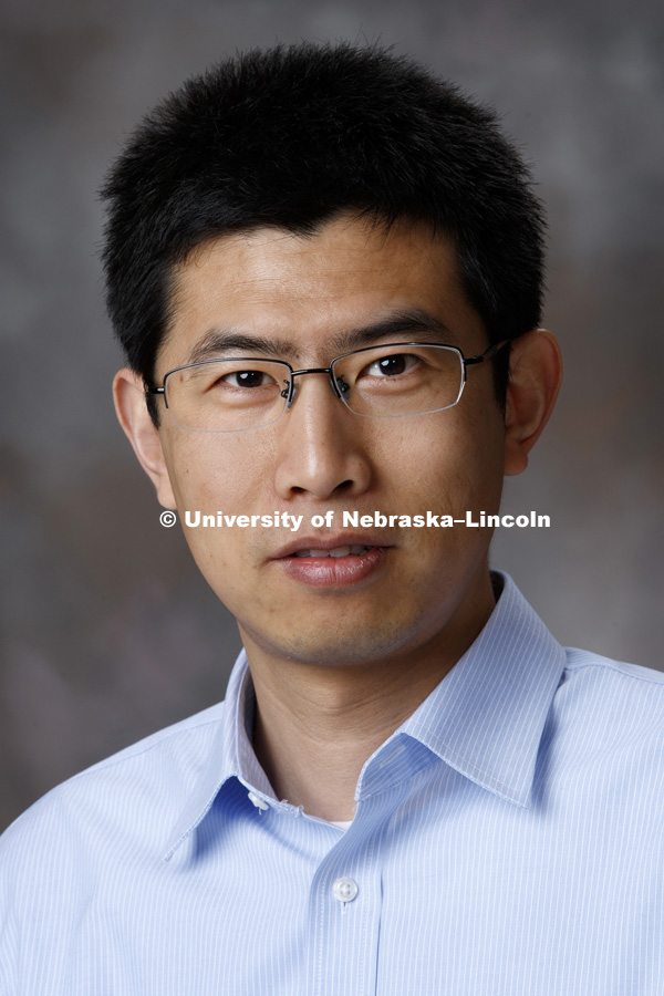 Studio portrait of Ruiguo Yang, Assistant Professor of Mechanical and Materials Engineering. May 26, 2017. Photo by Craig Chandler / University Communication.