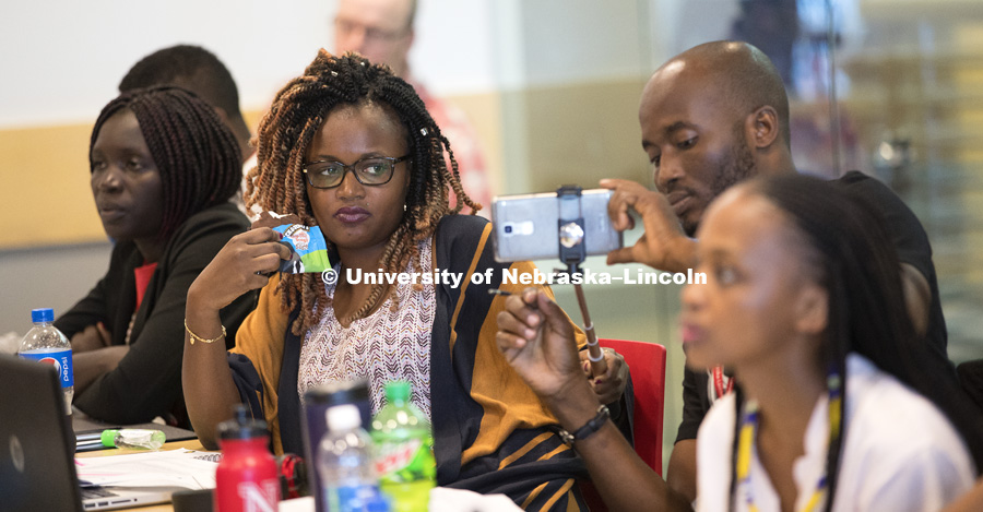 Obolibe from Togo films Fatou from Guinea sample a Ben and Jerry's ice cream slice while listening to Chris Tuggle, Assistant Professor of Marketing, talk about strategic management using the icre cream company as an example. Mandela Washington Fellowship