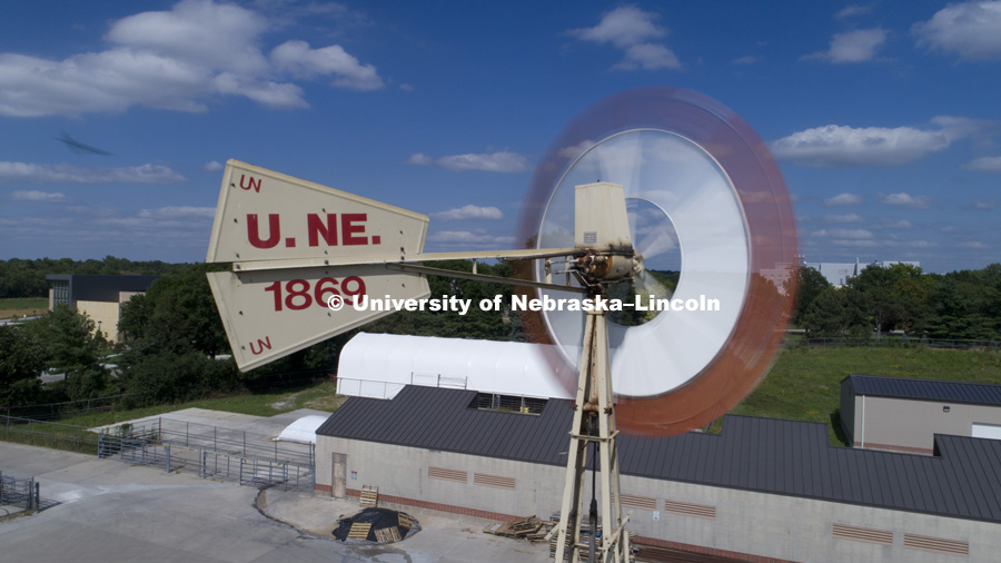 Windmill on east campus behind the Animal Science Building. At left is the new Veterinary Diagnostic Center. June 27, 2017. Photo by Craig Chandler / University Communication.