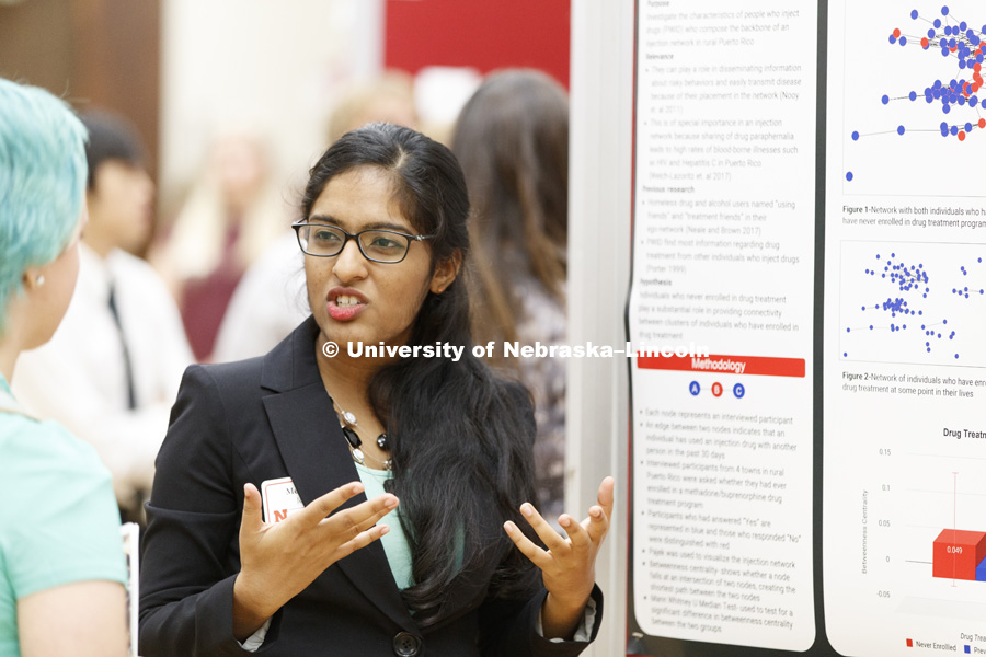 Mereena Jolly, of City College of New York, discusses her project as part of the Minority Health Disparities research group. Summer Research Symposium in the Nebraska Union ballroom. The summer research projects sponsored by the Office of Undergraduate