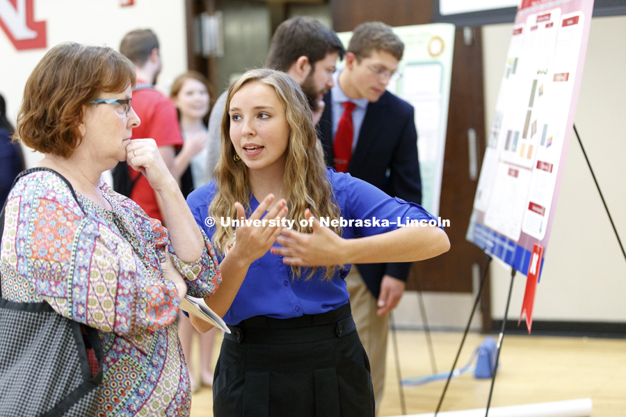 Mercedes Mansfield of Grove City College describes her physics project during the Summer Research Symposium in the Nebraska Union ballroom. The summer research projects sponsored by the Office of Undergraduate Studies brings undergrads from across the