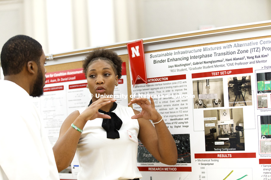 Jaya Washington of Savannah College describes her civil engineering research. Summer Research Symposium in the Nebraska Union ballroom. The summer research projects sponsored by the Office of Undergraduate Studies brings undergrads from across the nation