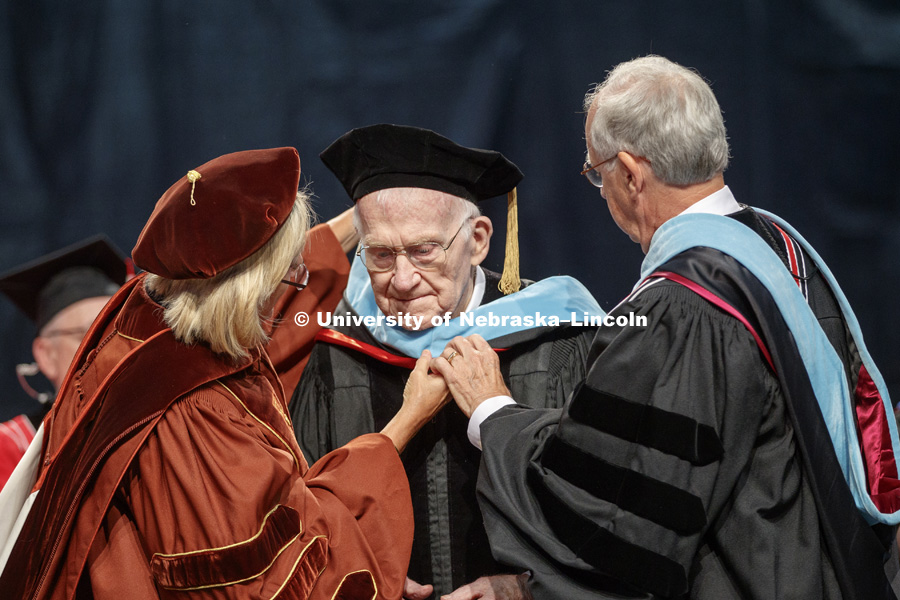 Roy Long receives an honorary Doctor of Education degree during the August Commencement at Pinnacle Bank Arena. Long is a 1947 Nebraska graduate whose college education was interrupted by World War 2 where he served in Patton's army, liberated a